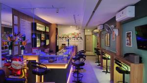 a barber shop with a bunch of stools at Terpenica - Rooms for Rent in Pattaya South