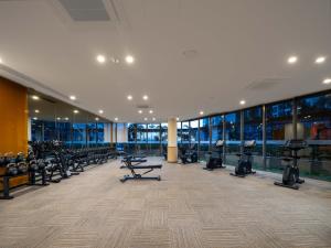 a gym with a lot of treadmills and machines at 慕海Mosea悠享海景三卧房4806 in Johor Bahru