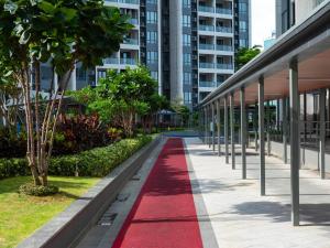 a red carpet walks down a sidewalk in a building at 慕海Mosea悠享海景三卧房4806 in Johor Bahru