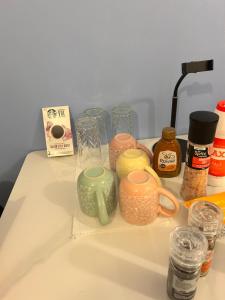 a counter top with cups and other items on it at Victoria place in Belfast