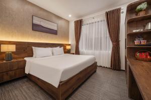 Ein Bett oder Betten in einem Zimmer der Unterkunft Kly Luxury Hotel