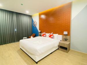 Postel nebo postele na pokoji v ubytování Asawann Hotel Suvarnabhumi