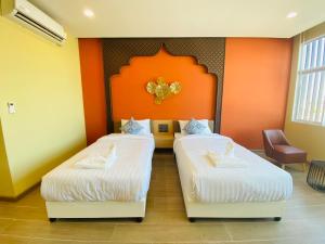 Postel nebo postele na pokoji v ubytování Asawann Hotel Suvarnabhumi