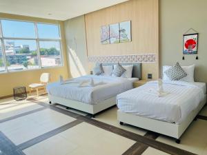 Postel nebo postele na pokoji v ubytování Asawann Hotel Suvarnabhumi