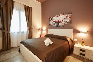 Postel nebo postele na pokoji v ubytování Il Vecchio Marsala
