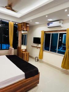 Μια τηλεόραση ή/και κέντρο ψυχαγωγίας στο Riverdale Homestay, Diamond Harbour - WB Govt Reg Gold Category +36 φωτογραφίες