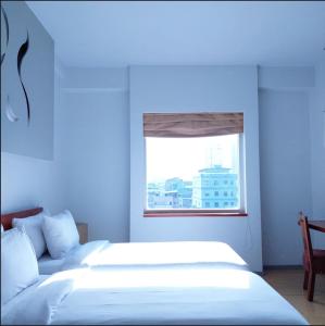 Voodi või voodid majutusasutuse Sparks Life Jakarta, ARTOTEL Curated toas