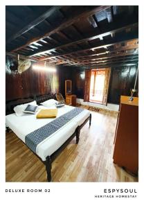 Giường trong phòng chung tại EspySoul Heritage Homestay