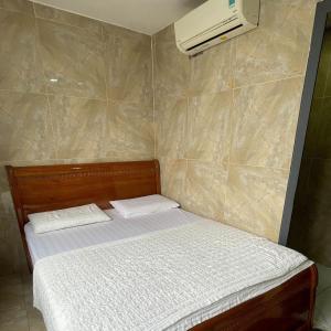 Postel nebo postele na pokoji v ubytování Le Lai Hotel