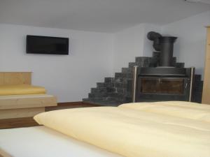 TV a/nebo společenská místnost v ubytování Ferienhaus Marian