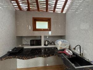 Kuchyň nebo kuchyňský kout v ubytování Ringsun Homestay Uluwatu