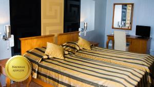 Postel nebo postele na pokoji v ubytování Duna Relax Hotel Ráckeve