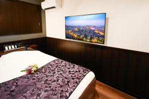 Postel nebo postele na pokoji v ubytování Ikebukuro Central Hotel + 37 fotografií
