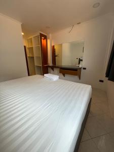 Ένα ή περισσότερα κρεβάτια σε δωμάτιο στο Todd Inn +1 φωτογραφίες