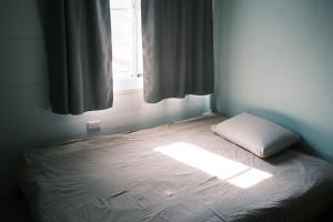 Una cama o camas en una habitación de A Forest Homestay