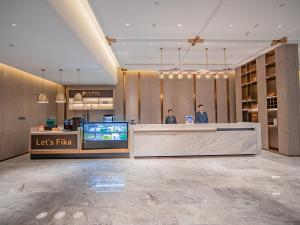 ล็อบบี้หรือแผนกต้อนรับของ Xiangyang Station Minfa World City Yishang Plus Hotel