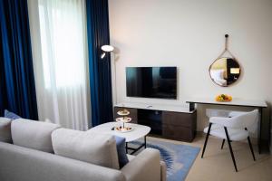 TV a/nebo společenská místnost v ubytování Jannah Executive Hotel Apartments