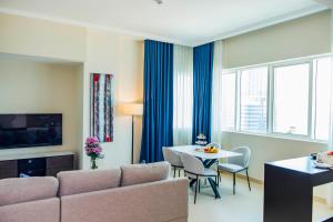 TV a/nebo společenská místnost v ubytování Jannah Executive Hotel Apartments
