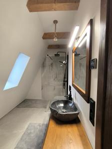 a bathroom with a sink in the middle of a room at Chalet Rafenstein in Moisei