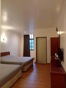 Postel nebo postele na pokoji v ubytování Hotel Chua Gin