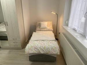 Postel nebo postele na pokoji v ubytování Omni Residence Vendégház