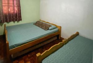 Postel nebo postele na pokoji v ubytování RedDoorz Hostel at MRC Residences Baguio