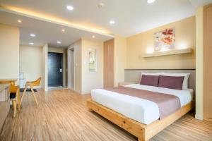 Postel nebo postele na pokoji v ubytování Jeju M Resort