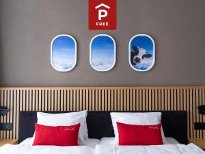Postel nebo postele na pokoji v ubytování Tailormade Hotel BAB Bachenbülach