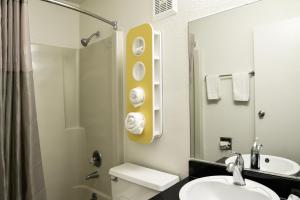 a bathroom with a sink and a toilet and a shower at Motel 6-Toledo, OH in Maumee
