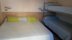 Postel nebo postele na pokoji v ubytování Hotel Niagara