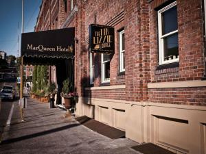 a sign on the side of a brick building at MarQueen Hotel in Seattle +6 photos