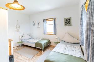 Postel nebo postele na pokoji v ubytování Haus Riedmann