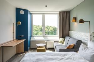 A bed or beds in a room at aja Warnemünde