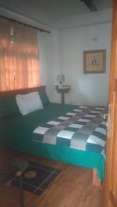 Ένα ή περισσότερα κρεβάτια σε δωμάτιο στο Hamadhi guest