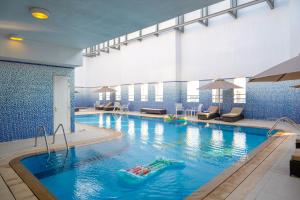Bazén v ubytování Jannah Executive Hotel Apartments nebo v jeho okolí
