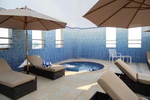 Bazén v ubytování Jannah Executive Hotel Apartments nebo v jeho okolí