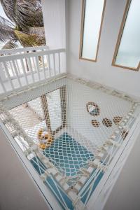 a crib in a room with a cribbing at Stories Stay pool villa Huahin พูลวิลล่าหัวหิน ติดทะเล in Sathani Khao Tao