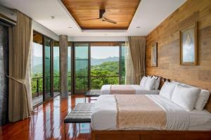 Postel nebo postele na pokoji v ubytování The Height Khaoyai Resort + 37 fotografií