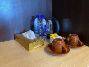 Příslušenství pro přípravu čaje a kávy v ubytování Lucky Star Hotel Near Harbour Bay Batam