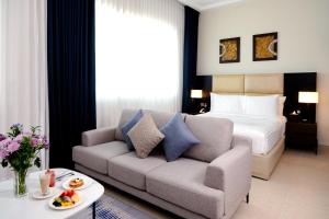 Postel nebo postele na pokoji v ubytování Jannah Executive Hotel Apartments
