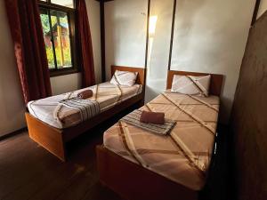 Postel nebo postele na pokoji v ubytování ABC Chalet Tioman