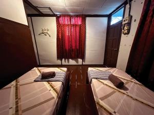 Postel nebo postele na pokoji v ubytování ABC Chalet Tioman