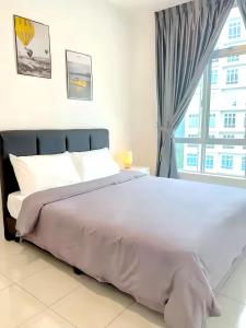 Postel nebo postele na pokoji v ubytování Anderson Residences Ipoh