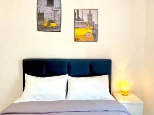 Postel nebo postele na pokoji v ubytování Anderson Residences Ipoh