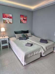 a bedroom with two beds with towels on them at Studio in city in Fuengirola