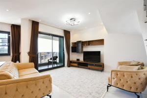 Posezení v ubytování 0205 Two Bedroom Duplex in Serenity Residents Comfortable and Modern Stay in Mahmutlar Alanya