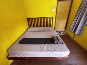 Postel nebo postele na pokoji v ubytování ABC Chalet Tioman