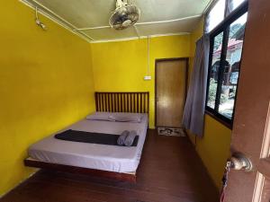 Postel nebo postele na pokoji v ubytování ABC Chalet Tioman