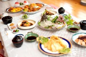 a table with many plates of food on it at 民宿ひろ in Kami Amakusa