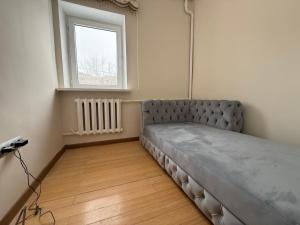 Ένα ή περισσότερα κρεβάτια σε δωμάτιο στο Medeu Residence